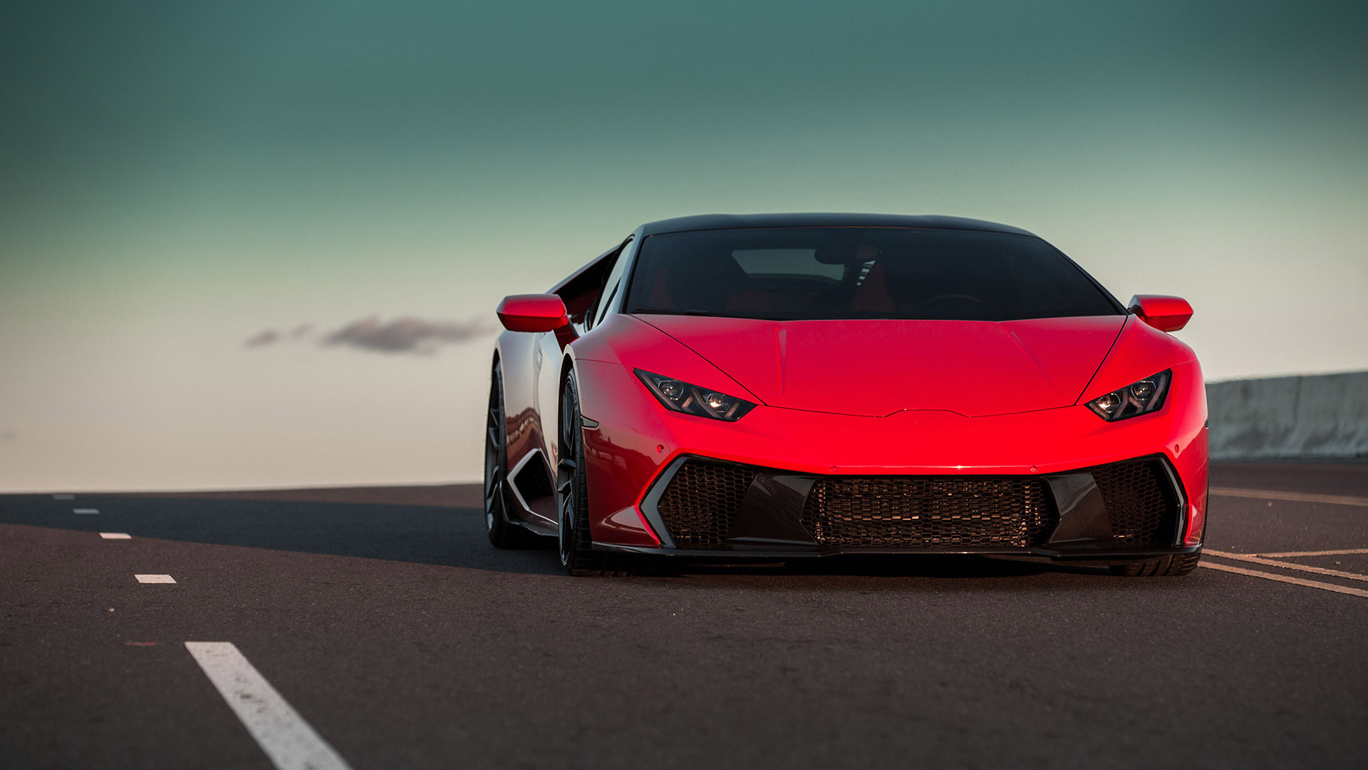 Red sports car on an open road